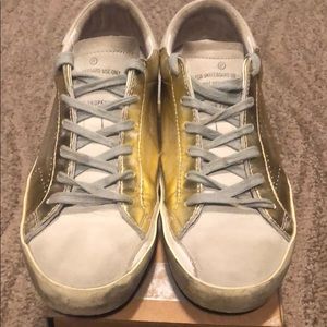 Golden Goose Superstar Sneakers in Metallic Gold